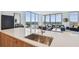 Modern kitchen with island, stainless steel sink, and hardwood floors next to a comfortable and stylish living room at 5120 Marina Way # 15005, Tampa, FL 33611
