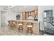 Modern kitchen features wood cabinets, stainless steel appliances, a wine cooler, and a large island with seating at 5120 Marina Way # 15005, Tampa, FL 33611