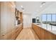 Modern kitchen design with an island, wood cabinets, stainless steel appliances, and views from the nearby window at 5120 Marina Way # 15005, Tampa, FL 33611