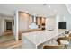 Well-lit kitchen with wood cabinetry, stainless steel appliances, large island, modern finishes, and ample storage at 5120 Marina Way # 15005, Tampa, FL 33611