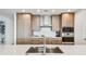 Sleek kitchen boasts stainless steel appliances, custom cabinetry, and quartz countertops, perfect for culinary enthusiasts at 5120 Marina Way # 15005, Tampa, FL 33611