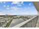 Scenic view of a tranquil lake from a balcony, showcasing nearby residential properties and expansive water views at 5120 Marina Way # 15005, Tampa, FL 33611