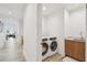 Convenient laundry room featuring a washer and dryer and sink area at 5120 Marina Way # 15005, Tampa, FL 33611