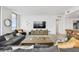 Modern living room with large windows, a comfortable seating area, and a stylish rug connecting the spaces at 5120 Marina Way # 15005, Tampa, FL 33611