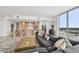 Bright living room with a large sectional couch, city views, and an open-concept design perfect for entertaining guests at 5120 Marina Way # 15005, Tampa, FL 33611