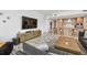 Open-concept living space with sleek furniture, bar seating, and contemporary design at 5120 Marina Way # 15005, Tampa, FL 33611