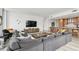 Modern living room featuring a large sectional sofa, floor-to-ceiling windows with city views, and stylish decor at 5120 Marina Way # 15005, Tampa, FL 33611