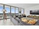 Open-concept living area featuring comfortable seating, a view of the kitchen, and modern décor for relaxed living at 5120 Marina Way # 15005, Tampa, FL 33611