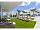 Luxurious outdoor lounge area with comfortable seating, lush greenery, and a serene ambiance for relaxation and social gatherings at 5120 Marina Way # 15005, Tampa, FL 33611