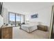Bright main bedroom featuring a city view, luxury chair, and light neutral tones at 5120 Marina Way # 15005, Tampa, FL 33611