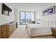 Bright main bedroom with city view, balcony, luxury chair, and neutral tones at 5120 Marina Way # 15005, Tampa, FL 33611