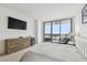 Bright main bedroom featuring a city view, luxury chair, and large TV at 5120 Marina Way # 15005, Tampa, FL 33611
