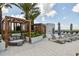 Elegant outdoor pool area with lounge chairs and shaded seating areas, providing a serene and upscale recreational space at 5120 Marina Way # 15005, Tampa, FL 33611