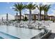 Stunning pool deck featuring modern lounge seating, pergolas and tropical palms creating a relaxing rooftop oasis at 5120 Marina Way # 15005, Tampa, FL 33611