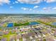 Expansive aerial view of a residential community with beautiful homes, serene lakes and lush landscaping at 537 Ocean Spray Dr, Ruskin, FL 33570