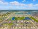 Stunning aerial view of a well-planned community with multiple lakes, manicured lawns, and beautiful homes at 537 Ocean Spray Dr, Ruskin, FL 33570