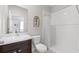 Clean bathroom featuring a single vanity, toilet, and a shower with a white shower curtain at 537 Ocean Spray Dr, Ruskin, FL 33570