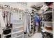 Organized walk-in closet with shelves, rods, and storage solutions for clothes and accessories at 537 Ocean Spray Dr, Ruskin, FL 33570