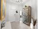 Bright foyer with tile flooring, display shelving and access to the living areas of the home at 537 Ocean Spray Dr, Ruskin, FL 33570