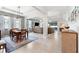 Open-concept living room with a dining space, comfortable seating, and large windows at 537 Ocean Spray Dr, Ruskin, FL 33570