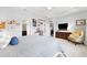 Spacious main bedroom featuring tray ceiling, carpet floors, and neutral wall paint at 537 Ocean Spray Dr, Ruskin, FL 33570