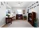Cozy office space with natural light, desk, shelving, and carpet flooring at 537 Ocean Spray Dr, Ruskin, FL 33570