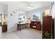 Bright office space with natural light, desk, and decorative accents at 537 Ocean Spray Dr, Ruskin, FL 33570