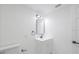Bright bathroom featuring an updated vanity, sleek fixtures, and a minimalist design at 5614 Bay Boulevard, Port Richey, FL 34668