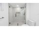 Contemporary bathroom with a glass shower and modern fixtures and tiling at 5614 Bay Boulevard, Port Richey, FL 34668