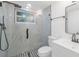 Bathroom with glass shower and a black and white design at 5614 Bay Boulevard, Port Richey, FL 34668