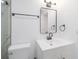 Bathroom with walk-in shower, black hardware, vanity and mirror at 5614 Bay Boulevard, Port Richey, FL 34668