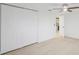 Bedroom with light wood floor and a closet at 5614 Bay Boulevard, Port Richey, FL 34668
