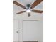 Bedroom featuring a ceiling fan and a closet at 5614 Bay Boulevard, Port Richey, FL 34668