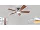 Bedroom featuring a ceiling fan and two windows at 5614 Bay Boulevard, Port Richey, FL 34668