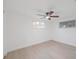 Bedroom featuring a ceiling fan and two windows at 5614 Bay Boulevard, Port Richey, FL 34668