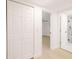 Hallway with a closet and views to the bath and bedroom at 5614 Bay Boulevard, Port Richey, FL 34668