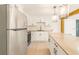 Stylish kitchen with white cabinets, stainless steel appliances, and an island at 5614 Bay Boulevard, Port Richey, FL 34668