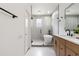 Bright bathroom featuring a modern vanity, freestanding tub, sleek glass shower, and stylish fixtures at 5628 Terrain De Golf Dr, Lutz, FL 33558