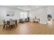 Stylish dining area featuring contemporary decor, laminate floors, and a decorative accent wall at 5628 Terrain De Golf Dr, Lutz, FL 33558