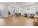 Inviting living area with laminate floors, a dining table, and two chairs for relaxing at 5628 Terrain De Golf Dr, Lutz, FL 33558