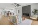 Open-concept living space with kitchen, living room, fireplace and contemporary decor at 5628 Terrain De Golf Dr, Lutz, FL 33558