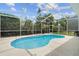 A screened-in pool provides a refreshing escape in a private backyard oasis, great for enjoying the outdoors at 5628 Terrain De Golf Dr, Lutz, FL 33558