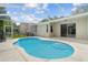 Enjoy the Florida sunshine in your screened-in pool, perfect for relaxation and entertaining at 5628 Terrain De Golf Dr, Lutz, FL 33558