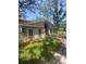 Charming single-story home with a neutral color scheme, awning, and mature landscaping for added privacy at 6214 Dewdrop Way # 621, Temple Terrace, FL 33617