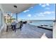 Expansive backyard patio includes an outdoor dining area and serene water views at 6418 Bright Bay Ct, Apollo Beach, FL 33572