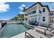 Luxury backyard features a pool, spa, lounge chairs, and outdoor seating at 6418 Bright Bay Ct, Apollo Beach, FL 33572