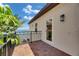 Outdoor balcony with tile flooring and wrought iron fencing overlooks the waterway at 6418 Bright Bay Ct, Apollo Beach, FL 33572