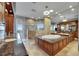 Lavish bathroom with granite counters, double sinks, soaking tub, and a tile shower with a window at 6418 Bright Bay Ct, Apollo Beach, FL 33572
