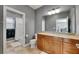 Bathroom featuring a wooden vanity with granite countertop, toilet, and shower/tub combination at 6418 Bright Bay Ct, Apollo Beach, FL 33572
