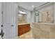 Bathroom featuring tiled walls, glass shower, and wood vanity at 6418 Bright Bay Ct, Apollo Beach, FL 33572